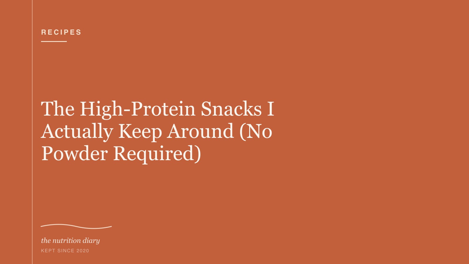 A fridge shelf with Greek yogurt, boiled eggs, cheese and a tub of hummus